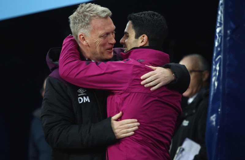 MANCHESTER, ENGLAND - DECEMBER 03: David Moyes, Manager of West Ham United and Mikel Arteta, assistant coach of Manchester City greet each other du...