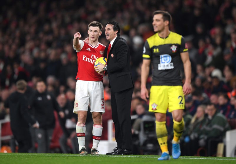 LONDON, ENGLAND - NOVEMBER 23: Kieran Tierney of Arsenal receives tips from Unai Emery, Manager of Arsenal during the Premier League match between ...