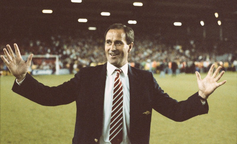 How Arsenal won the league at Anfield in 1989 2 LIVERPOOL, UNITED KINGDOM - MAY 26: Arsenal manager George Graham celebrates on the pitch after Arsenal had beaten Liverpool 2-0 to win the First Division Championship at Anfield on May 26, 1989 in Liverpool, England. (Photo by Allsport/Getty Images)