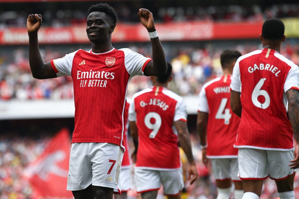 Arsenal's business not done after Rice & Timber 3 Arsenal news, gossip, transfers - Arsenal's English midfielder Bukayo Saka celebrates after scoring his team's third goal during the English Premier League football match between Arsenal and Wolverhampton Wanderers at the Emirates Stadium in London on May 28, 2023. (Photo by GLYN KIRK/AFP via Getty Images)