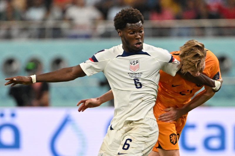 USA's midfielder #06 Yunus Musah (L) fights for the ball with Netherlands' midfielder #21 Frenkie De Jong during the Qatar 2022 World Cup round of ...