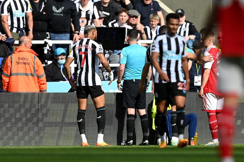 Alan Shearer outraged at rightfully overturned penalty against Arsenal 2 NEWCASTLE UPON TYNE, ENGLAND - MAY 07: Referee Chris Kavanagh looks at a Monitor as they watch a VAR Review for a potential penalty during the Premier League match between Newcastle United and Arsenal FC at St. James Park on May 07, 2023 in Newcastle upon Tyne, England. (Photo by Michael Regan/Getty Images)