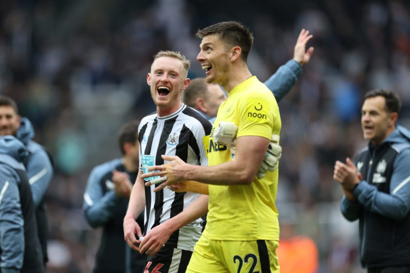 NEWCASTLE UPON TYNE, ENGLAND - APRIL 23: Sean Longstaff and Nick Pope of Newcastle United celebrate after the team's victory during the Premier League match between Newcastle United and Tottenham Hotspur at St. James Park on April 23, 2023 in Newcastle upon Tyne, England. (Photo by Clive Brunskill/Getty Images)