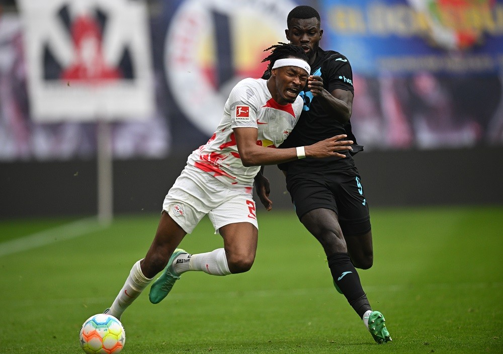 2 journalists confirm strong Arsenal interest in RB Leipzig 23yo 3 LEIPZIG, GERMANY: Mohamed Simakan of Leipzig is challenged by Ihlas Bebou of Hoffenheim during the Bundesliga match between RB Leipzig and TSG Hoffenheim at Red Bull Arena on April 29, 2023. (Photo by Stuart Franklin/Stuart Franklin/Getty Images)