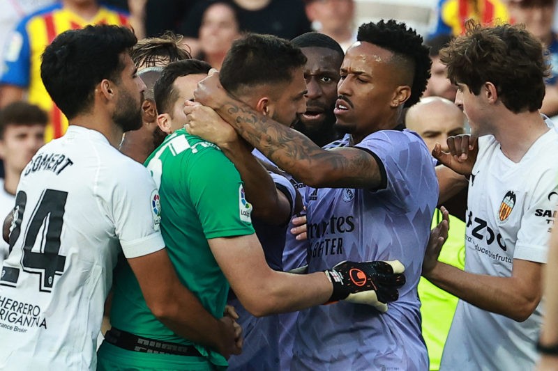 Former Arsenal man explains comments after racial abuse of Real Madrid's Vini Jr 3 TOPSHOT - Valencia's Georgian goalkeeper Giorgi Mamardashvili (C) argues with Real Madrid's Brazilian defender Eder Militao (2R) and teammates during the Spanish league football match between Valencia CF and Real Madrid CF at the Mestalla stadium in Valencia on May 21, 2023. (Photo by JOSE JORDAN / AFP) (Photo by JOSE JORDAN/AFP via Getty Images)