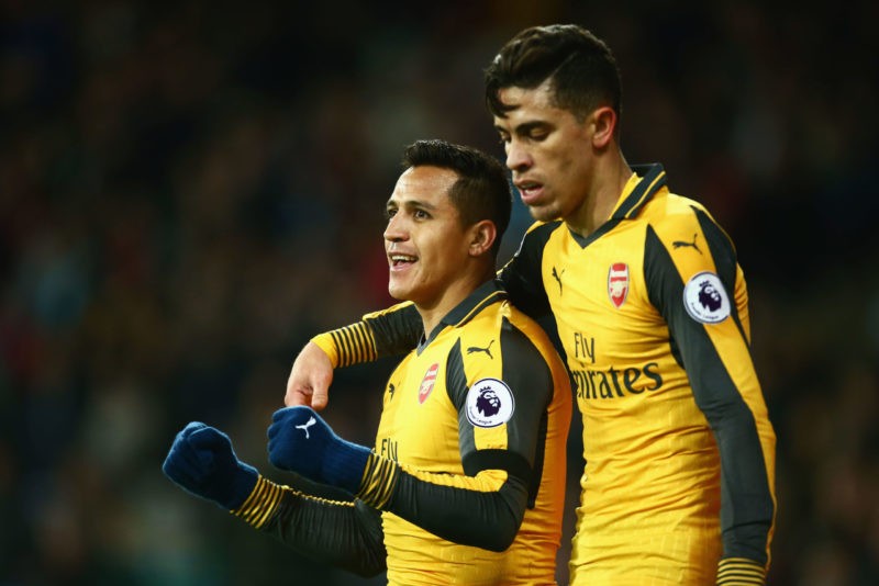 LONDON, ENGLAND - DECEMBER 03: Alexis Sanchez of Arsenal celebrates with Gabriel Paulista after scoring his team's second goal during the Premier L...