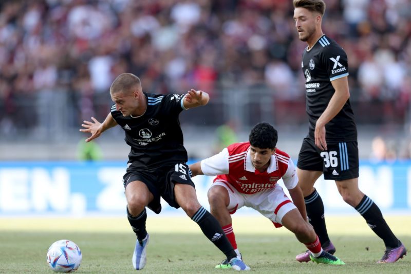 Nuremberg ready for Arsenal 'absolute endurance test' 3 NUREMBERG, GERMANY - JULY 08: Fabian Nürnberger (L)of Nürnberg and his team mate Lukas Schleimer battle for the ball with Salah Oulad M'Hand (C) of Arsenal during the pre-season friendly match between 1. FC Nürnberg and Arsenal F.C. at Max-Morlock-Stadion on July 08, 2022 in Nuremberg, Germany. (Photo by Alexander Hassenstein/Getty Images)