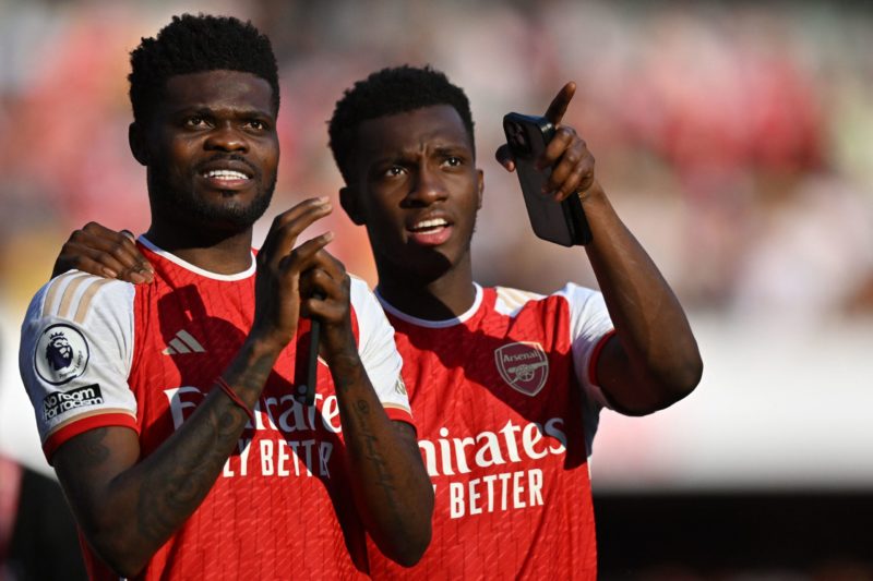 Arsenal's Ghanaian midfielder Thomas Partey speaks to Arsenal's English striker Eddie Nketiah (R) during the English Premier League football match ...