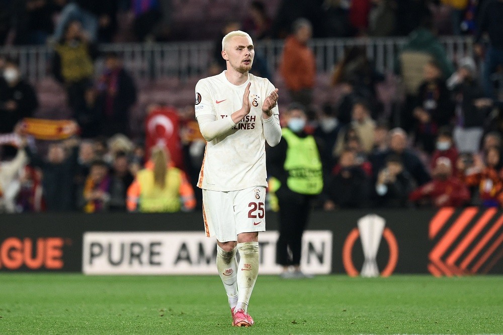Galatasaray's Danish defender Victor Nelsson applauds at the end of the UEFA Europa League round of 16 first leg football match between FC Barcelon...
