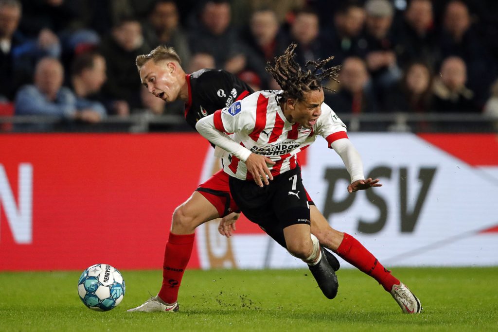 Excelsior's Dutch midfielder Julian Baas (L) fights for the ball with PSV's Dutch midfielder Xavi Simons during the Dutch Eredivisie football match between PSV Eindhoven and Excelsior Rotterdam at the Phillips Stadium in Eindhoven on April 8, 2023. (Photo by BART STOUTJESDIJK/ANP/AFP via Getty Images)
