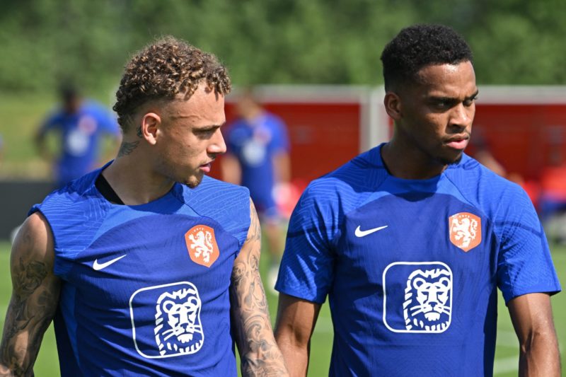 22yo to 'no longer report' at training as Arsenal deal completes 3 Netherland's forward Wout Weghorst (L) and Netherland's defender Jurrien Timber take part in a training session at Qatar University training site 6 in Doha on November 18, 2022 ahead of the Qatar 2022 World Cup football tournament.(Photo by ALBERTO PIZZOLI/AFP via Getty Images)