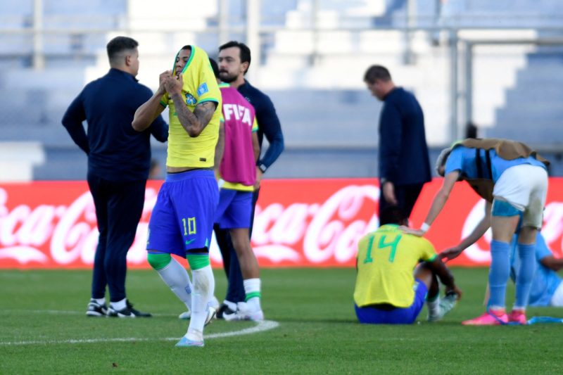 Brazil's midfielder Matheus Martins (L) reacts after losing 3-2 in extra-time of the Argentina 2023 U-20 World Cup quarter-final football match bet...