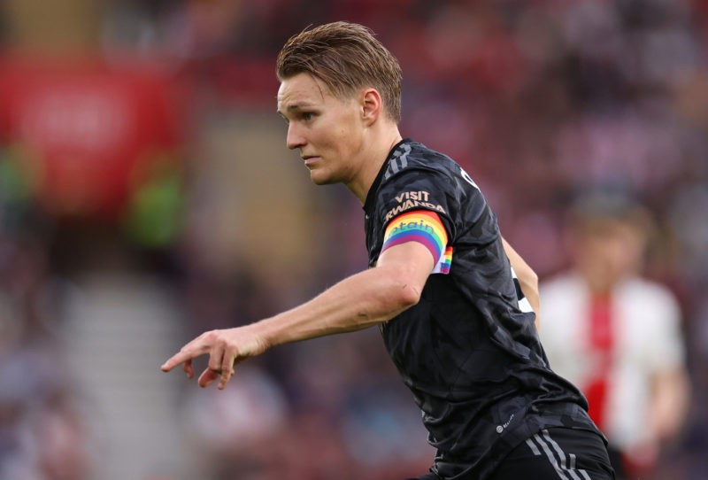 Arsenal champions LGBTQ+ rights during Pride Month 4 SOUTHAMPTON, ENGLAND - OCTOBER 23: Martin Oedegaard of Arsenal runs with the ball wearing the Rainbow Laces captains armband during the Premier League match between Southampton FC and Arsenal FC at Friends Provident St. Mary's Stadium on October 23, 2022 in Southampton, England. (Photo by Ryan Pierse/Getty Images)