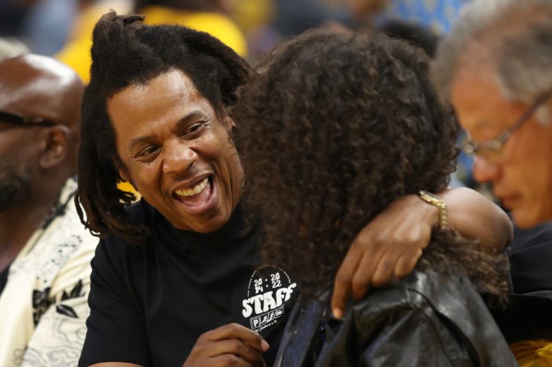 SAN FRANCISCO, CALIFORNIA - JUNE 13: Rapper Jay-Z hugs his daughter Blue Ivy Carter during the second quarter of Game Five of the 2022 NBA Finals b...