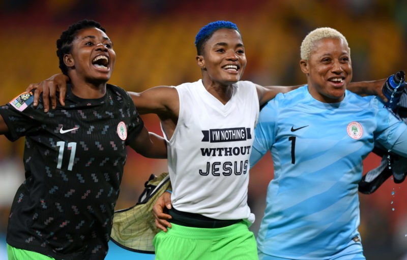 BRISBANE, AUSTRALIA - JULY 27: Gift Monday, Rasheedat Ajibade and Tochukwu Oluehi of Nigeria celebrate after winning the FIFA Women's World Cup Australia & New Zealand 2023 Group B match between Australia and Nigeria at Brisbane Stadium on July 27, 2023 in Brisbane, Australia. (Photo by Justin Setterfield/Getty Images)