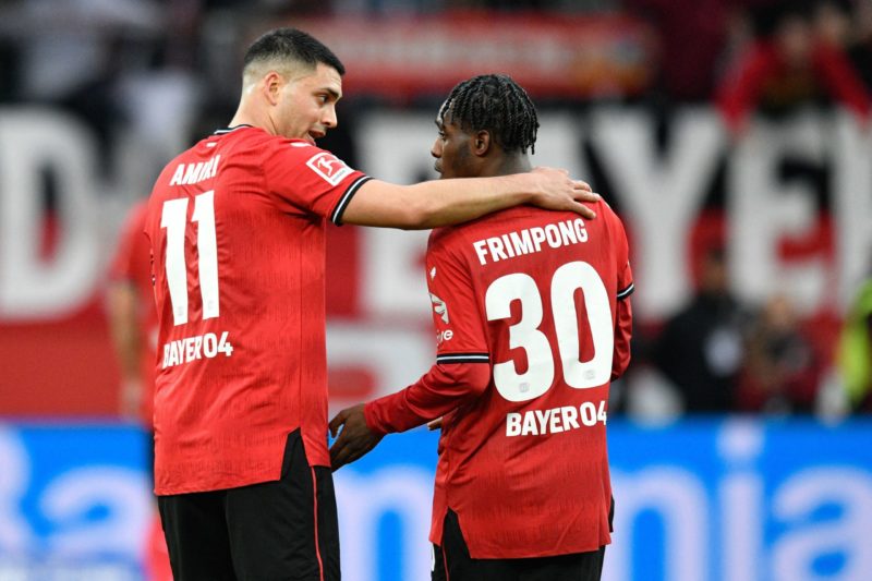 Leverkusen's German midfielder Nadiem Amiri (L) and Leverkusen's Dutch defender Jeremie Frimpong speak after the German first division Bundesliga football match between Bayer Leverkusen and RB Leipzig in Leverkusen, western Germany on April 23, 2023.(Photo by SASCHA SCHUERMANN/AFP via Getty Images)