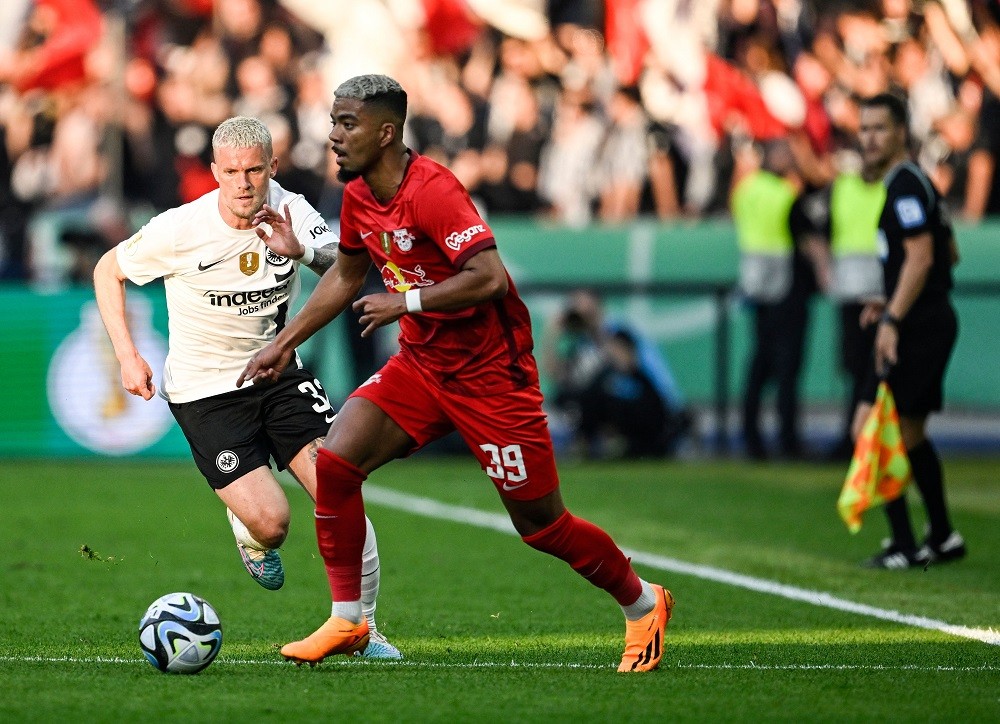 Frankfurt's German defender Philipp Max (L) and Leipzig's German defender Benjamin Henrichs vie for the ball during the German Cup (DFB Pokal) final football match RB Leipzig v Eintracht Frankfurt in Berlin, Germany, on June 3, 2023. (Photo by TOBIAS SCHWARZ/AFP via Getty Images)