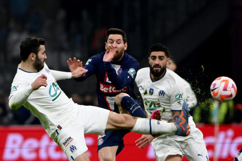 TOPSHOT - Paris Saint-Germain's Argentine forward Lionel Messi (C) fights for the ball with Marseille's Bosnian defender Sead Kolasinac (L) and Marseille's French defender Samuel Gigot during the French Cup round of 16 football match between Olympique Marseille (OM) and Paris Saint-Germain (PSG) at Stade Velodrome in Marseille, southern France on February 8, 2023.  (Photo by CHRISTOPHE SIMON/AFP via Getty Images)