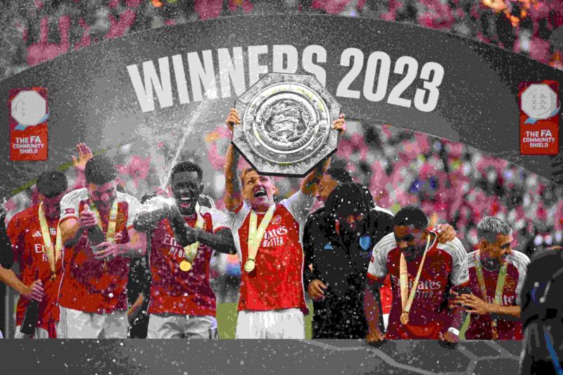Martin Odegaard of Arsenal lifts the FA Community Shield Trophy following the team's victory after the penalty shootout during The FA Community Shi...