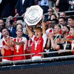 LONDON, ENGLAND - AUGUST 06: Martin Odegaard of Arsenal lifts the The FA Community Shield following The FA Community Shield match between Manchester City against Arsenal at Wembley Stadium on August 06, 2023 in London, England. (Photo by Mike Hewitt/Getty Images)