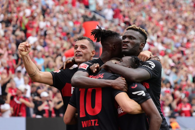 LEVERKUSEN, GERMANY - AUGUST 19: Florian Wirtz of Bayer 04 Leverkusen celebrates after scoring his team's third goal with teammates during the Bund...