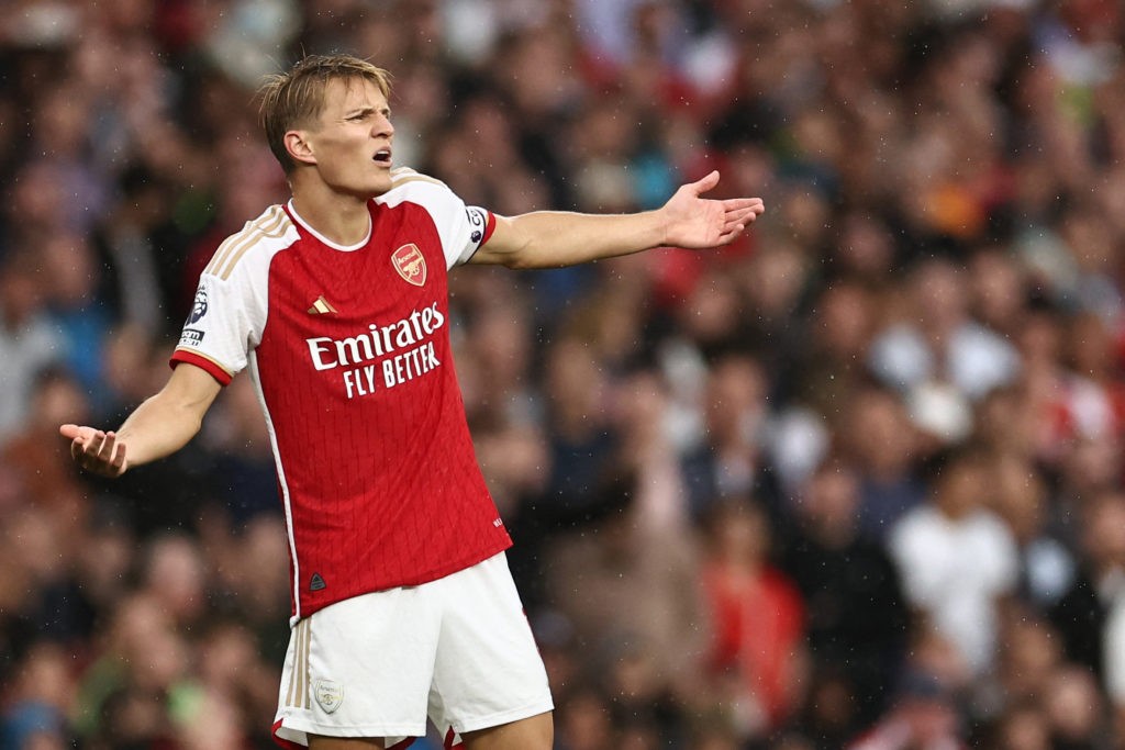 Martin Odegaard reacts to his new Arsenal chant 4 Arsenal's Norwegian midfielder #08 Martin Odegaard reacts during the English Premier League football match between Arsenal and Fulham at the Emirates Stadium in London on August 26, 2023. (Photo by HENRY NICHOLLS/AFP via Getty Images)