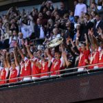 Arsenal's Norwegian midfielder Martin Odegaard (C) lifts the trophy after Arsenal win the shoot-out after the English FA Community Shield football match between Arsenal and Manchester City at Wembley Stadium, in London, August 6, 2023. Arsenal won after a 4-1 penalty shoot-out win, following the 1-1 draw in 90 minutes. (Photo by JUSTIN TALLIS/AFP via Getty Images)