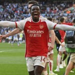 Arsenal's English striker Eddie Nketiah (C) and teammates celebrate after Arsenal win the penalty shoot-out after the English FA Community Shield football match between Arsenal and Manchester City at Wembley Stadium, in London, August 6, 2023. Arsenal won after a 4-1 penalty shoot-out win, following the 1-1 draw in 90 minutes. (Photo by JUSTIN TALLIS/AFP via Getty Images)