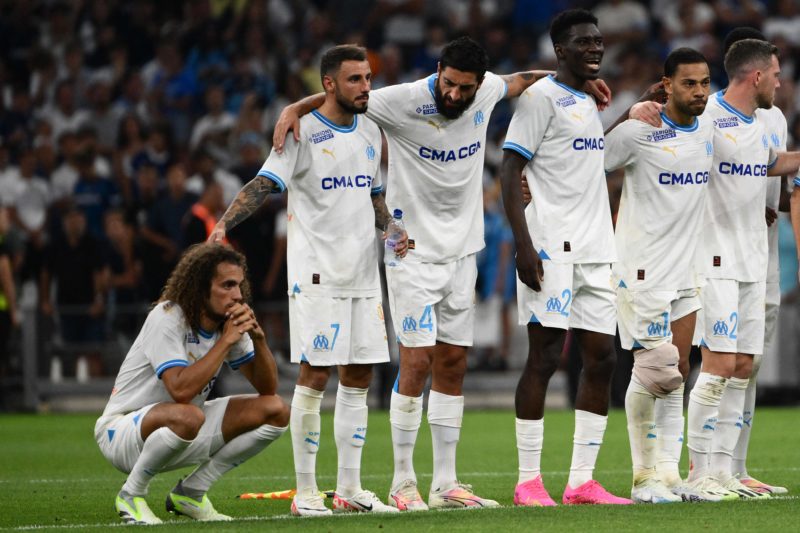 Former Arsenal star costs own side Champions League place 3 Marseille's French midfielder #06 Matteo Guendouzi (L) reacts after missing his penalty during the penalty shootout of the UEFA Champions League second leg of the third qualifying round football match between Olympique Marseille (OM) and Panathinaikos at the Velodrome stadium in Marseille, on August 15, 2023. (Photo by CHRISTOPHE SIMON/AFP via Getty Images)