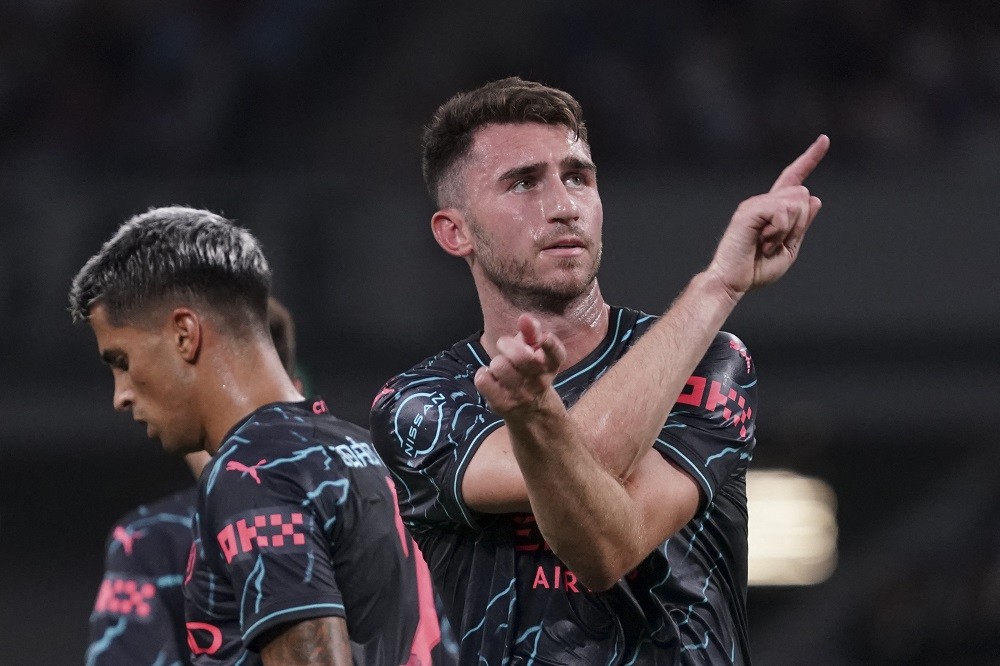 Manchester City defender Aymeric Laporte (R) reacts after his goal during the International friendly football match between Bayern Munich of German...