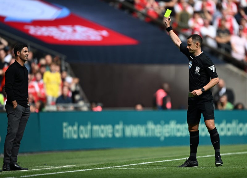 LONDON, ENGLAND - AUGUST 06: Mikel Arteta, Manager of Arsenal is shown a yellow card by Referee Stuart Attwell during The FA Community Shield match...