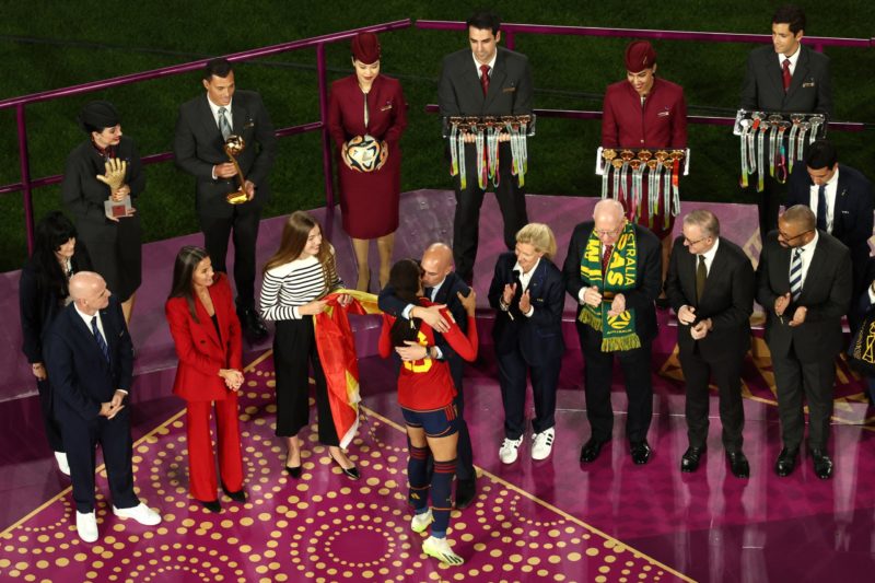 TOPSHOT - President of the Royal Spanish Football Federation Luis Rubiales (C) embraces Spain's forward #18 Salma Paralluelo on the podium after Sp...