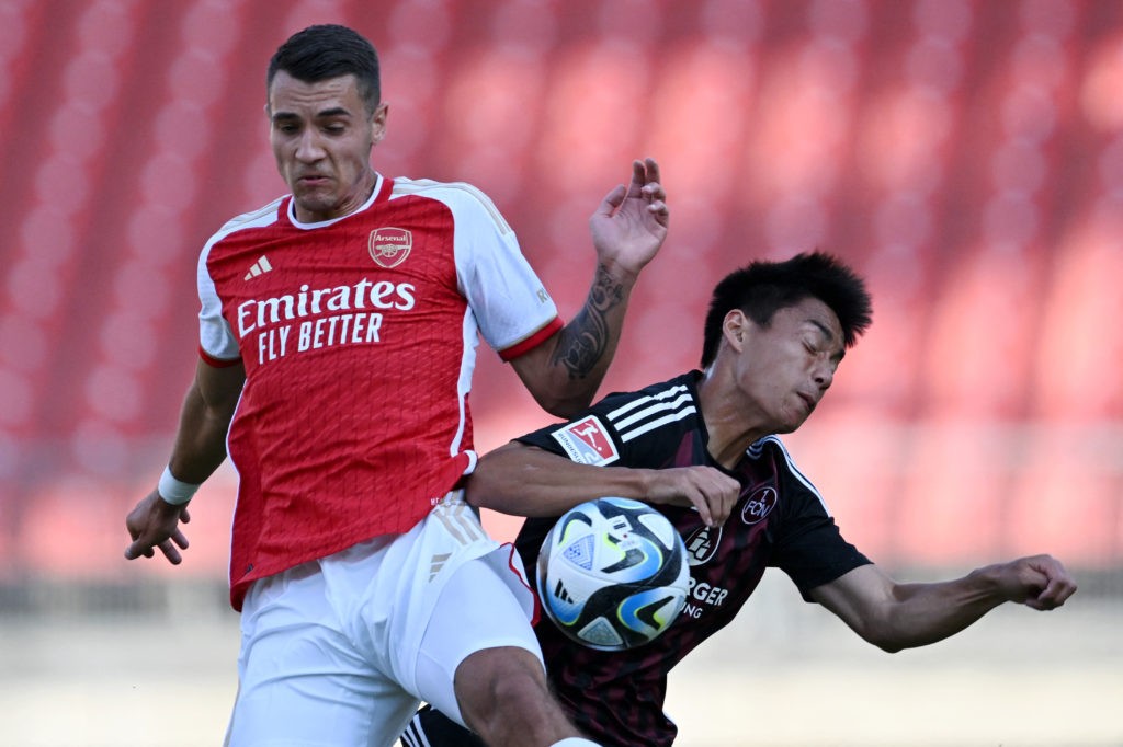 Arsenal set stance amid AC Milan interest in 23yo 3 Arsenal's Polish defender Jakub Kiwior (L) and Nuernberg's Japanese forward Daichi Hayashi vie for the ball during the pre-season friendly football match FC Nuernberg vs FC Arsenal in Nuremberg, on July 13, 2023. (Photo by CHRISTOF STACHE/AFP via Getty Images)