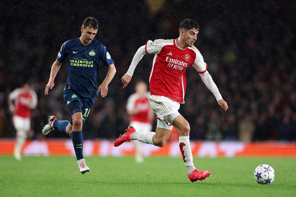 How Arsenal plan to get the most out of struggling star 3 LONDON, ENGLAND: Kai Havertz of Arsenal runs with the ball whilst under pressure from Olivier Boscagli of PSV Eindhoven during the UEFA Champions League match between Arsenal FC and PSV Eindhoven at Emirates Stadium on September 20, 2023. (Photo by Julian Finney/Getty Images)