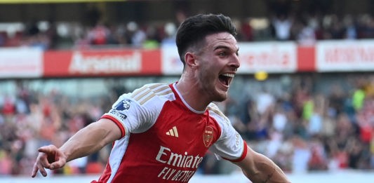 Arsenal's English midfielder #41 Declan Rice celebrates after scoring their late second goal during the English Premier League football match between Arsenal and Manchester United at the Emirates Stadium in London on September 3, 2023. (Photo by GLYN KIRK/AFP via Getty Images)