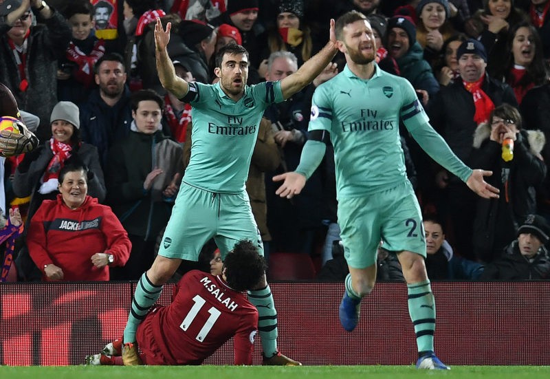 Former Arsenal man given 1 month to prove himself at new club 2 Arsenal's German defender Shkodran Mustafi (R) reacts after English referee Michael Oliver (unseen) awarded Liverpool's Egyptian midfielder Mohamed Salah (L) a penalty after he was fouled by Arsenal's Greek defender Sokratis Papastathopoulos during the English Premier League football match between Liverpool and Arsenal at Anfield in Liverpool, north west England on December 29, 2018. (Photo credit PAUL ELLIS/AFP via Getty Images)