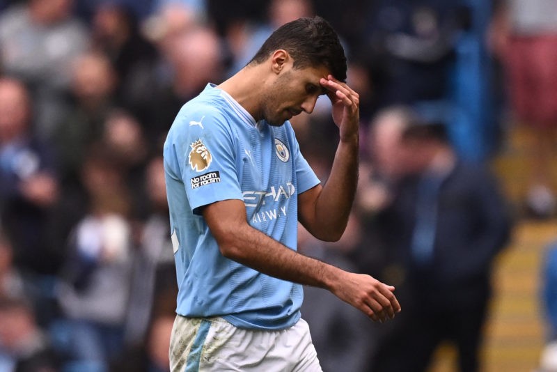 Manchester City's Spanish midfielder #16 Rodri reacts as he leaves the pitch having been sent off during the English Premier League football match ...
