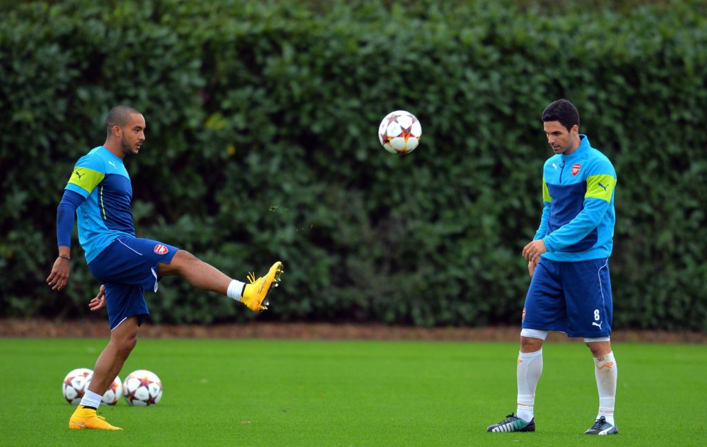 "I'm relaxed": Arsenal legends predict Porto 2nd-leg result 3 Arsenal's English striker Theo Walcott (L) and Spanish midfielder Mikel Arteta (R) attend a training session at the London Colney, North London, on November 3, 2014, on the eve of the UEFA Champions League Group D football match between Arsenal and Anderlecht. (Photo by GLYN KIRK/AFP via Getty Images)