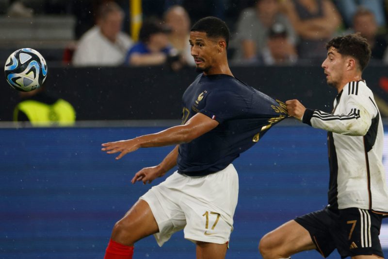 Germany's midfielder #07 Kai Havertz fouls France's defender #17 William Saliba during the friendly football match between Germany and France in Do...