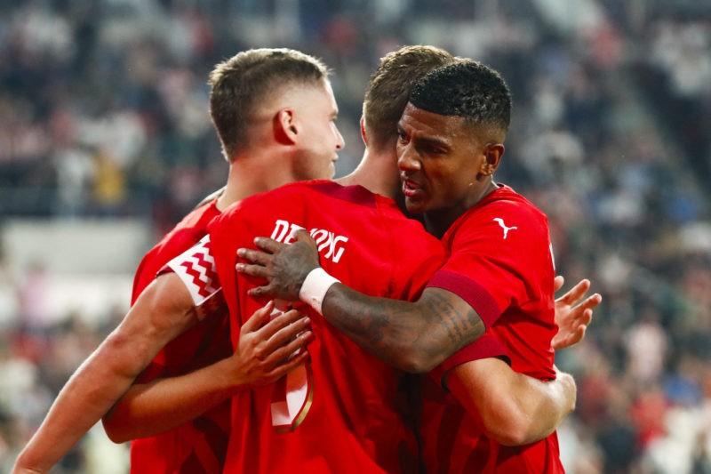 PSV Eindhoven Netherland's forward #09 Luuk de Jong and teammate Netherland's defender #30 Patrick van Aanholt celebrate the 3-0 celebrate their 3r...