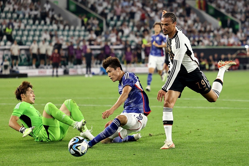 Arsenal international ends injury fears with return to action 4 WOLFSBURG, GERMANY: Takehiro Tomiyasu of Japan blocks a shot from Leroy Sane of Germany inside the box during the international friendly match between Germany and Japan at Volkswagen Arena on September 09, 2023. (Photo by Christof Koepsel/Getty Images)