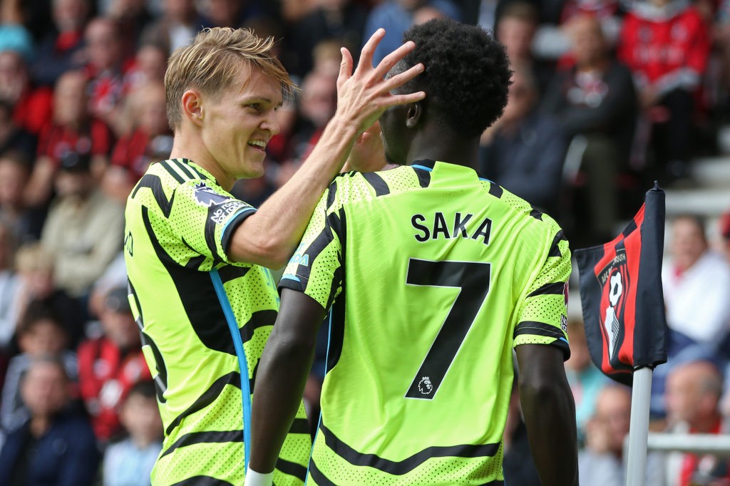 BOURNEMOUTH, ENGLAND - SEPTEMBER 30: Bukayo Saka of Arsenal celebrates with teammate Martin Odegaard after scoring the team's first goal during the Premier League match between AFC Bournemouth and Arsenal FC at Vitality Stadium on September 30, 2023 in Bournemouth, England. (Photo by Steve Bardens/Getty Images)