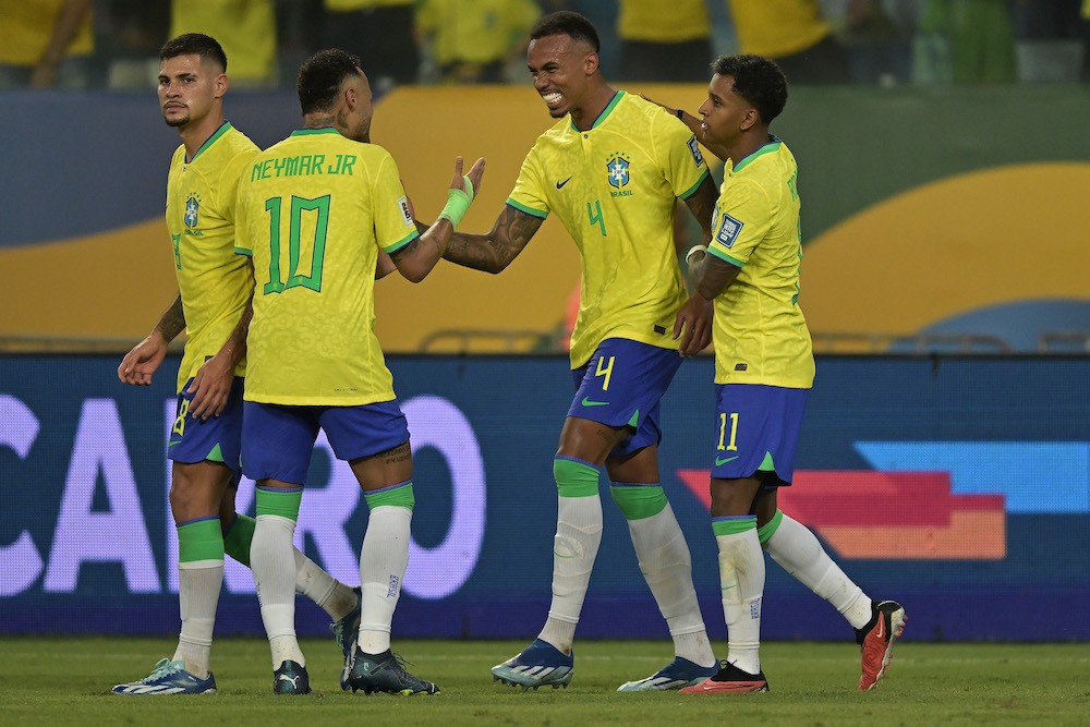 CUIABA, BRAZIL: Gabriel Magalhães of Brazil celebrates with teammates after scoring the first goal of their team during a FIFA World Cup 2026 Quali...