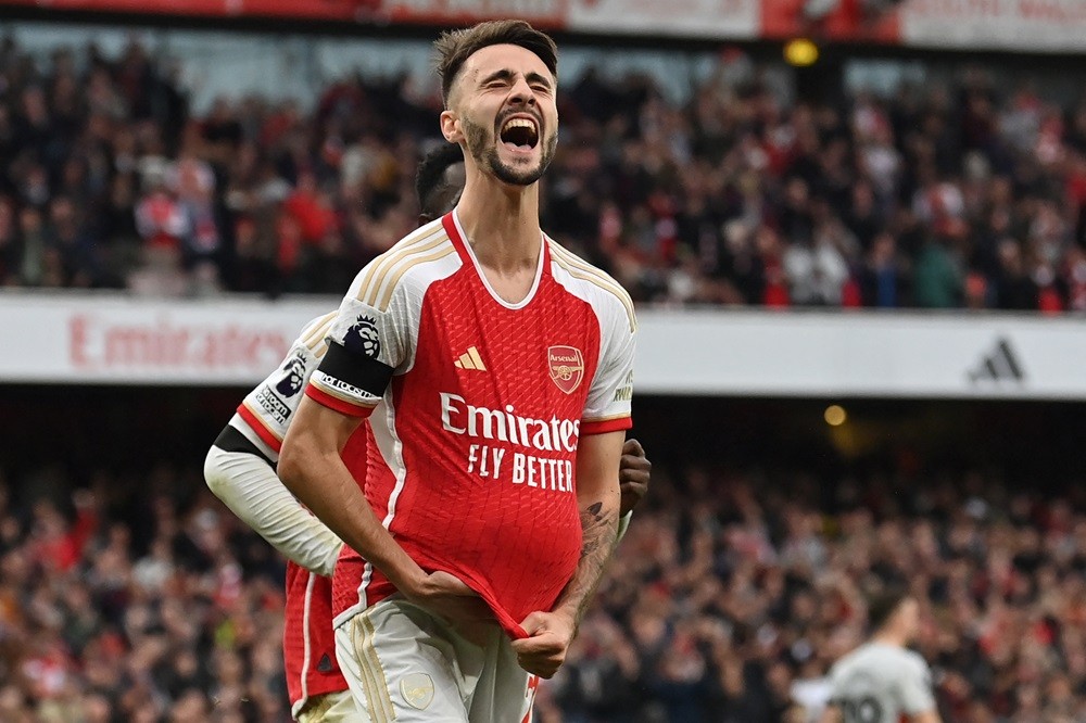 Arsenal's Fabio Vieira celebrates after scoring their fourth goal from the penalty spot during the English Premier League football match between Ar...