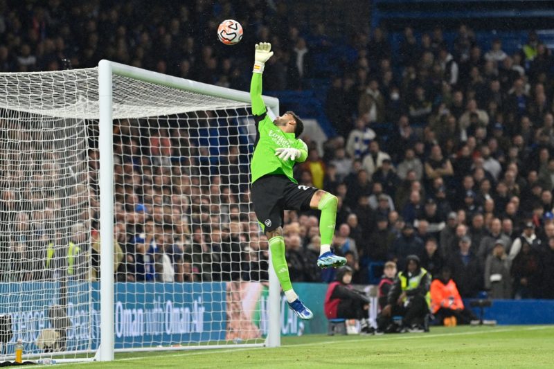 A cross-shot from Chelsea's Ukrainian midfielder #10 Mykhailo Mudryk loops over Arsenal's Spanish goalkeeper #22 David Raya and into the net for Chelsea's second goal during the English Premier League football match between Chelsea and Arsenal at Stamford Bridge in London on October 21, 2023. (Photo by JUSTIN TALLIS/AFP via Getty Images)