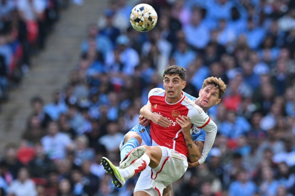 Arsenal's German midfielder Kai Havertz (L) vies with Manchester City's English defender John Stones (R) during the English FA Community Shield football match between Arsenal and Manchester City at Wembley Stadium, in London, August 6, 2023. (Photo by GLYN KIRK/AFP via Getty Images)