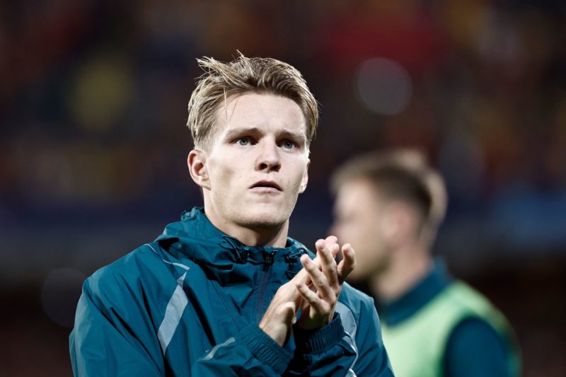 Arsenal's Norwegian midfielder #08 Martin Odegaard reacts after losing the UEFA Champions League Group B first leg football match between RC Lens a...