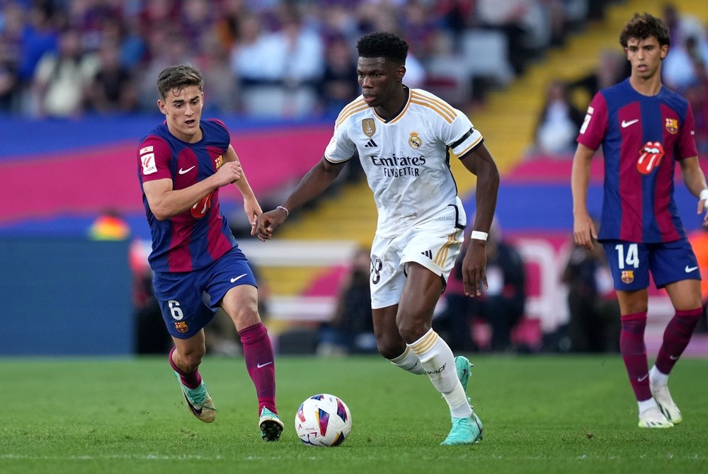 BARCELONA, SPAIN: Aurelien Tchouameni of Real Madrid on the ball whilst under pressure from Gavi of FC Barcelona during the LaLiga EA Sports match ...