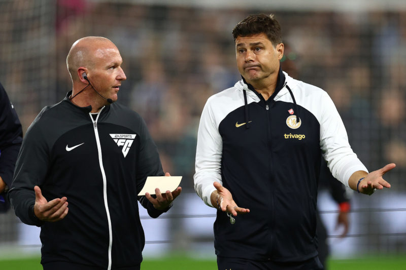 LONDON, ENGLAND - OCTOBER 02: Mauricio Pochettino, Manager of Chelsea, chats to Simon Hooper (l) ahead of the Premier League match between Fulham F...