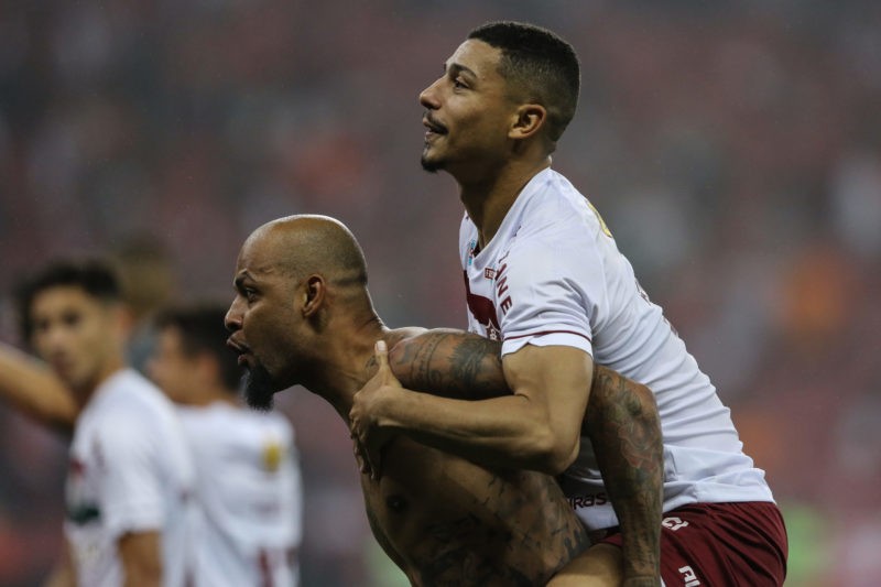 PORTO ALEGRE, BRAZIL - OCTOBER 04: Felipe Melo (L) and Andre (R) of Fluminense celebrate the victory during the second leg of the Copa CONMEBOL Lib...